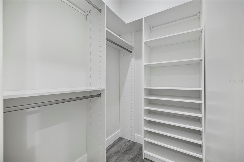 3525 McIntosh Road Sarasota, FL 34232 - Photo 29 of 40 a view of walk in closet with empty racks