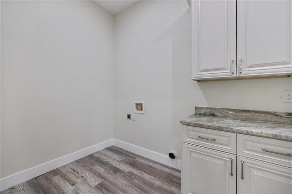 3525 McIntosh Road Sarasota, FL 34232 - Photo 30 of 40 a view of cabinets and wooden floor
