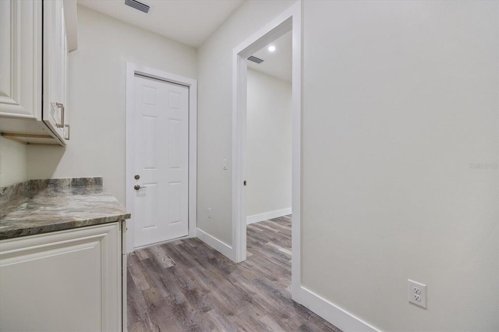 3525 McIntosh Road Sarasota, FL 34232 - Photo 31 of 40 a view of hallway with wooden floor