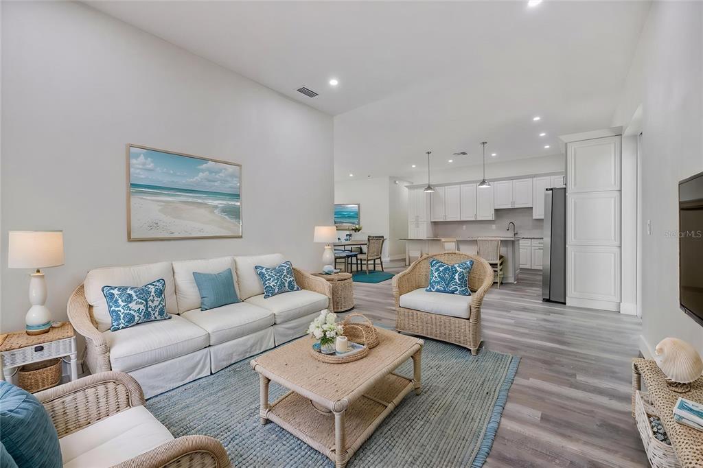 3525 McIntosh Road Sarasota, FL 34232 - Photo 8 of 40 a living room with furniture and a wooden floor