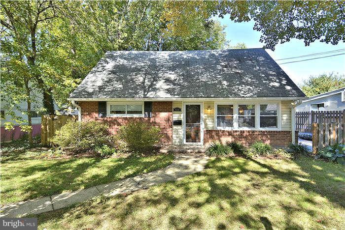 711 Justin Way Silver Spring, MD 20901 - Photo 1 of 22 front view of house with a yard