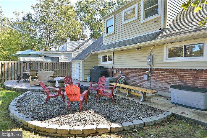 711 Justin Way Silver Spring, MD 20901 - Photo 12 of 22 a chairs and table in a backyard
