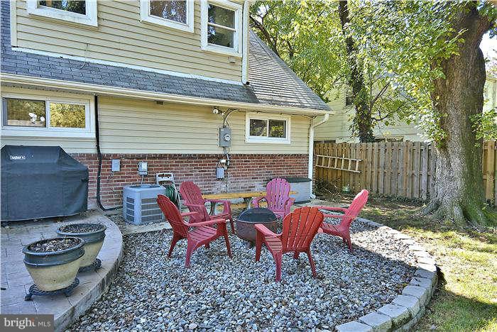 711 Justin Way Silver Spring, MD 20901 - Photo 13 of 22 a backyard of a house with yard and outdoor seating