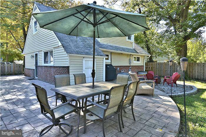 711 Justin Way Silver Spring, MD 20901 - Photo 14 of 22 a view of a table and chairs under an umbrella
