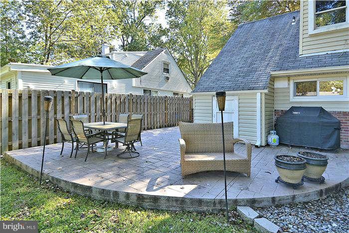 711 Justin Way Silver Spring, MD 20901 - Photo 15 of 22 a view of a patio with furniture and a backyard