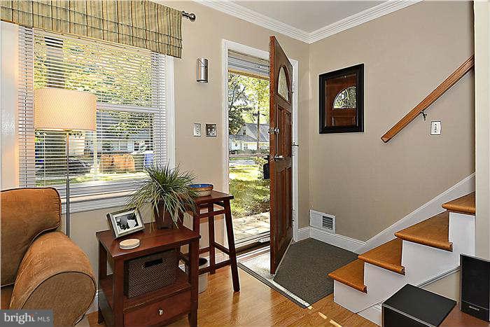 711 Justin Way Silver Spring, MD 20901 - Photo 4 of 22 a living room with furniture and a potted plant