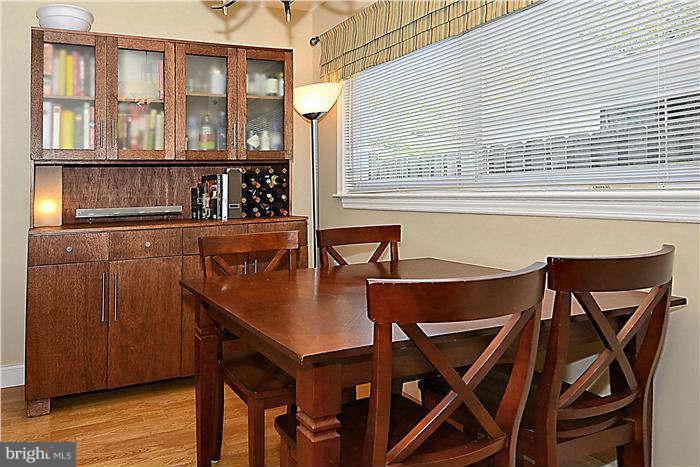 711 Justin Way Silver Spring, MD 20901 - Photo 5 of 22 a view of a dining room with furniture and wooden floor