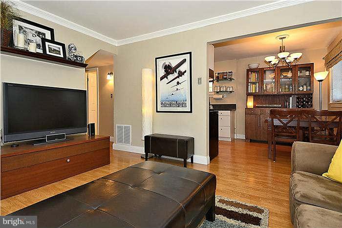 711 Justin Way Silver Spring, MD 20901 - Photo 8 of 22 a living room with furniture and a flat screen tv