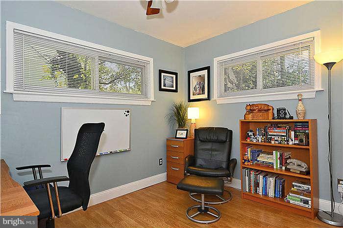 711 Justin Way Silver Spring, MD 20901 - Photo 9 of 22 a view of a workspace with furniture and a window