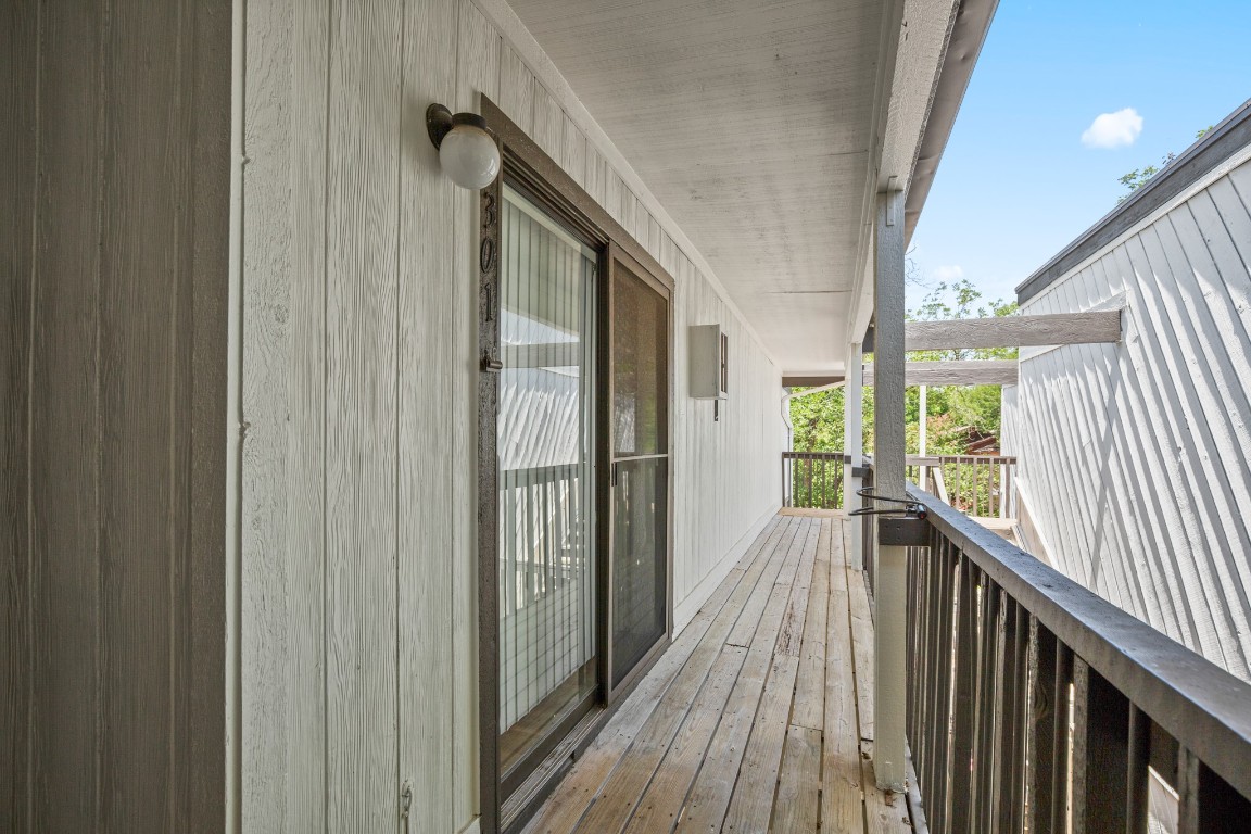 4205 Speedway, Unit 301 Austin, TX 78751 - Photo 19 of 19 a view of a hallway with wooden floor and staircase