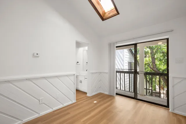 a view of front door with wooden floor