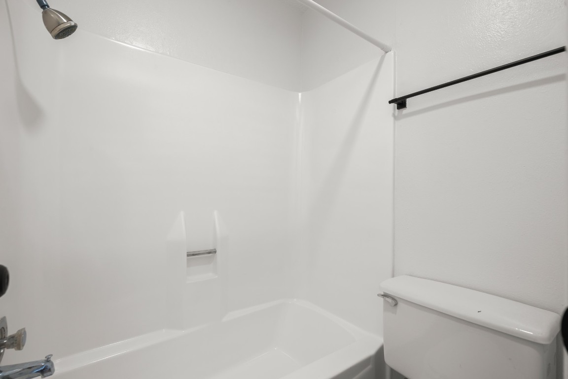 4205 Speedway, Unit 301 Austin, TX 78751 - Photo 10 of 19 a bathroom with a shower and a toilet