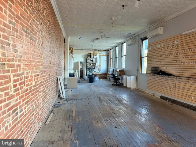 a view of a living room with a wooden floor