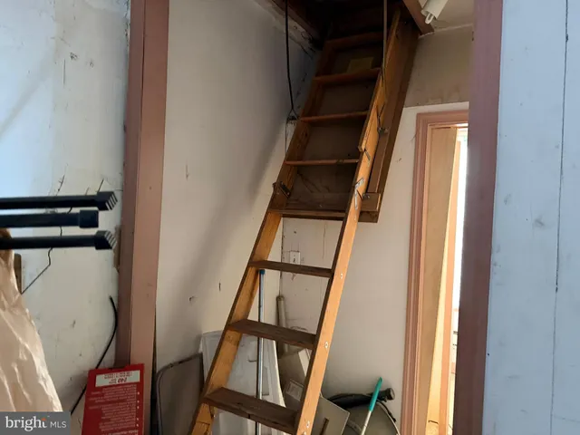 a bathroom with a toilet and a shower curtain