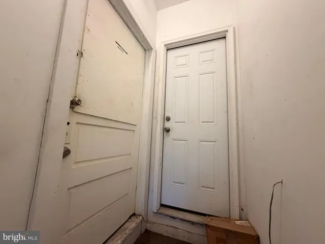 a view of a hallway with entryway