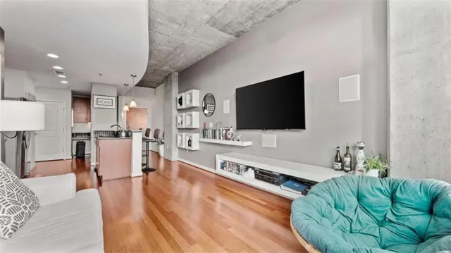 a living room with furniture and a flat screen tv