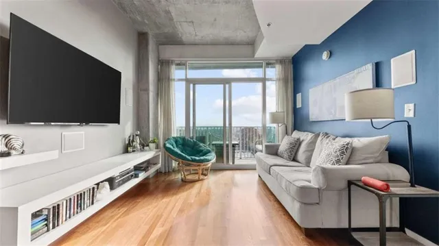 a living room with furniture and a flat screen tv