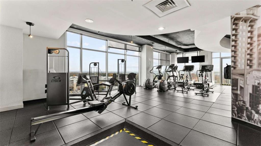 250 Pharr Road Northeast, Unit 712 Atlanta, GA 30305 - Photo 25 of 34 a view of a room with gym equipment