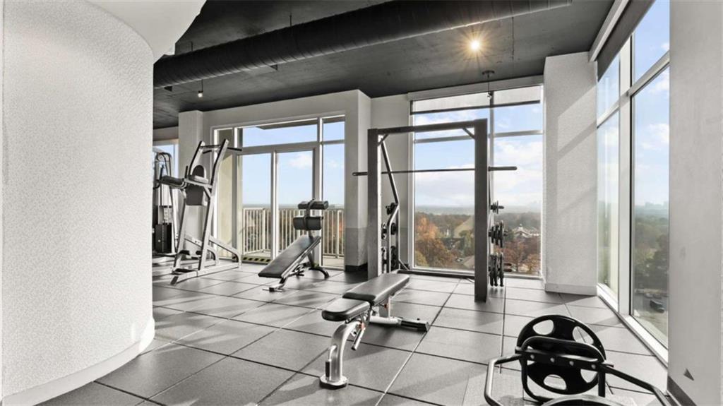 250 Pharr Road Northeast, Unit 712 Atlanta, GA 30305 - Photo 28 of 34 a view of a room with gym equipment