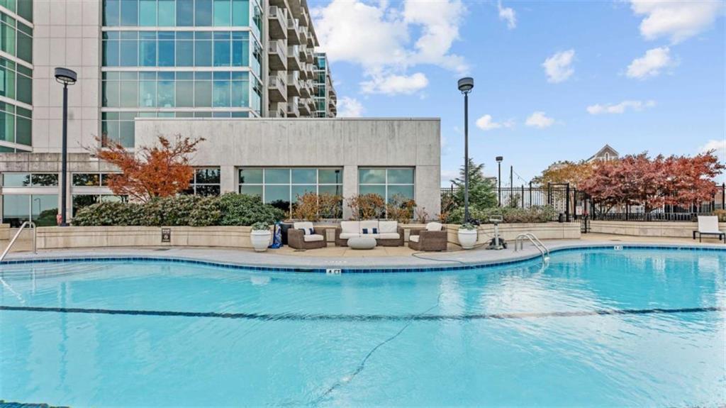 250 Pharr Road Northeast, Unit 712 Atlanta, GA 30305 - Photo 30 of 34 a view of a house with swimming pool
