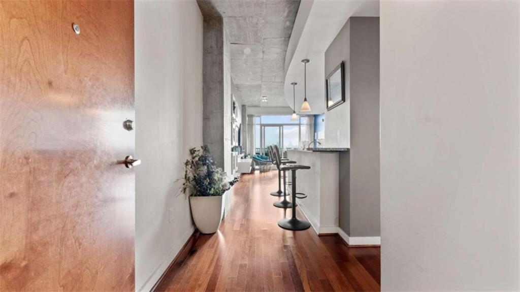 250 Pharr Road Northeast, Unit 712 Atlanta, GA 30305 - Photo 9 of 34 wooden floor in a gallery