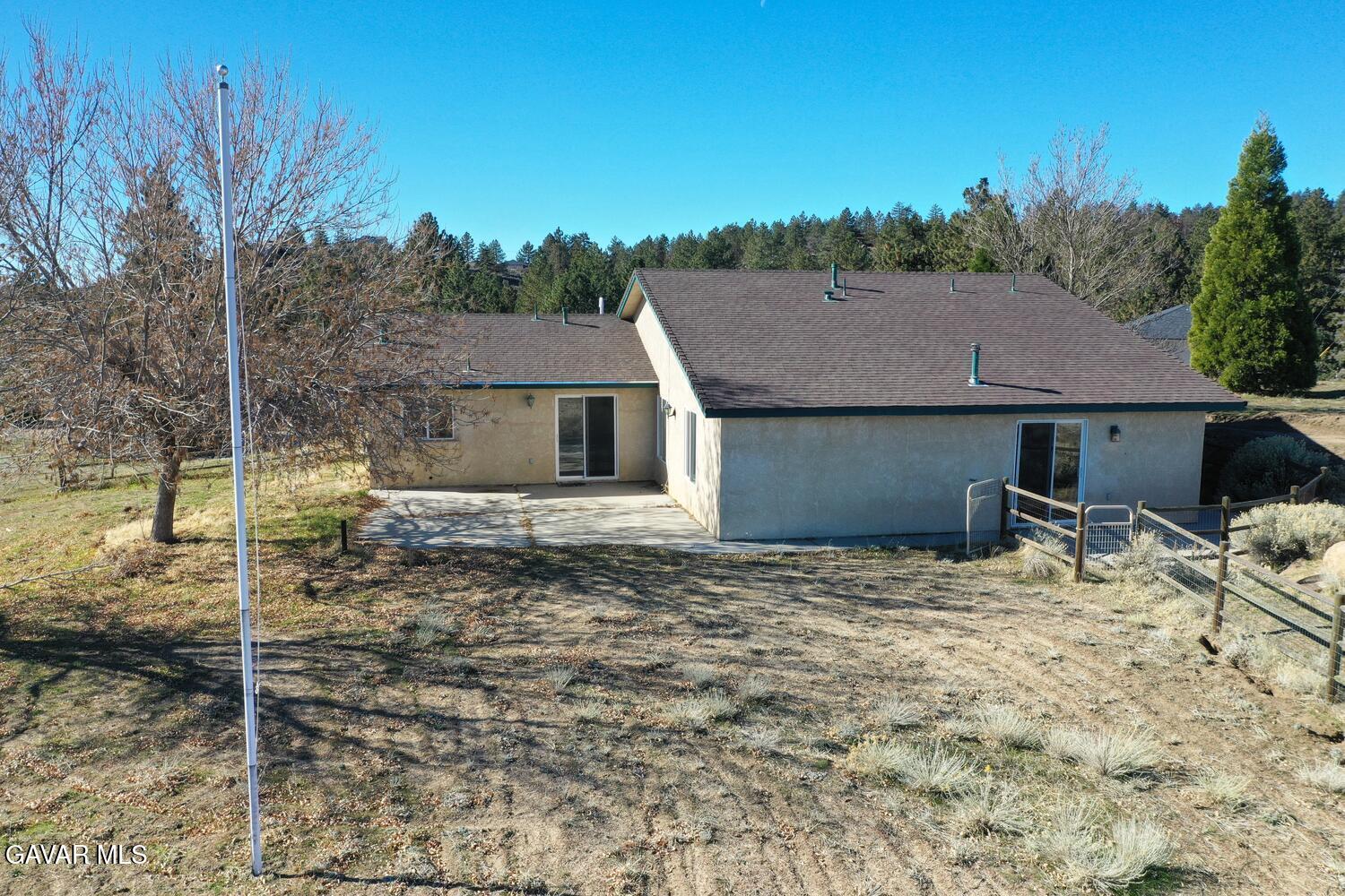 26801 Cabriolet Court Tehachapi, CA 93561 - Photo 57 of 60 a house with trees in the background