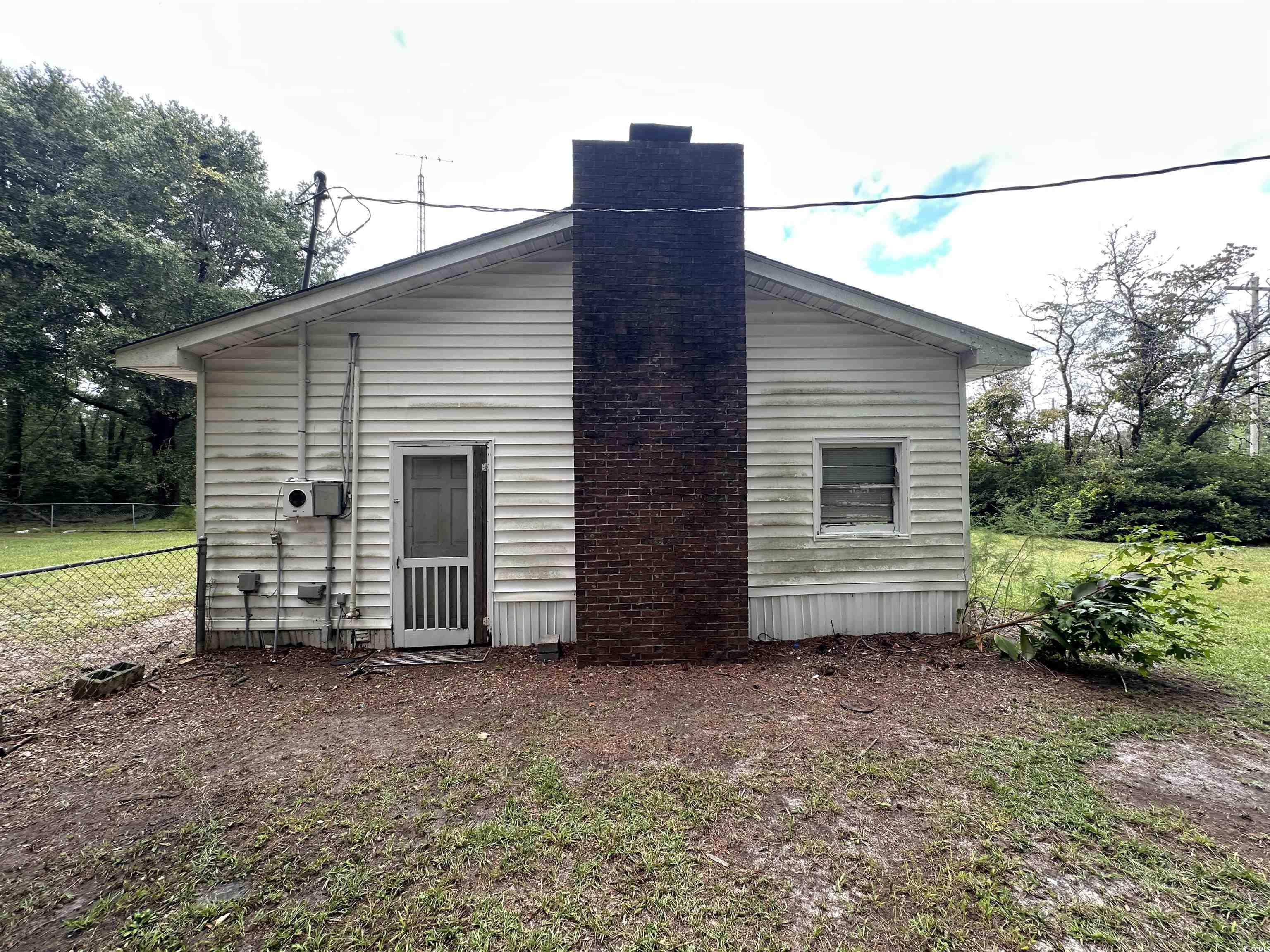 11185 Old Pee Dee Road Hemingway, SC 29554 - Photo 15 of 15 Back of property featuring a chimney