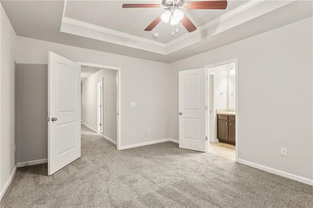 a view of room with window and ceiling fan