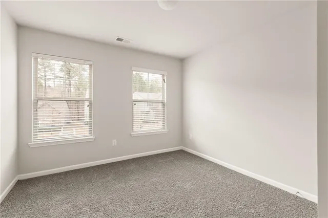 a bathroom with a sink a mirror and vanity
