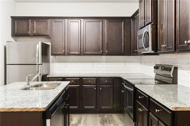 a kitchen with a sink and cabinets