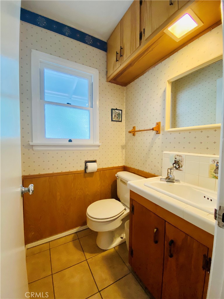 1917 Lyans Drive La Canada Flintridge, CA 91011 - Photo 12 of 25 a bathroom with a sink a toilet and mirror