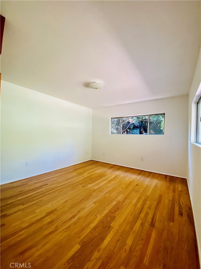 1917 Lyans Drive La Canada Flintridge, CA 91011 - Photo 16 of 25 a view of empty room with wooden floor