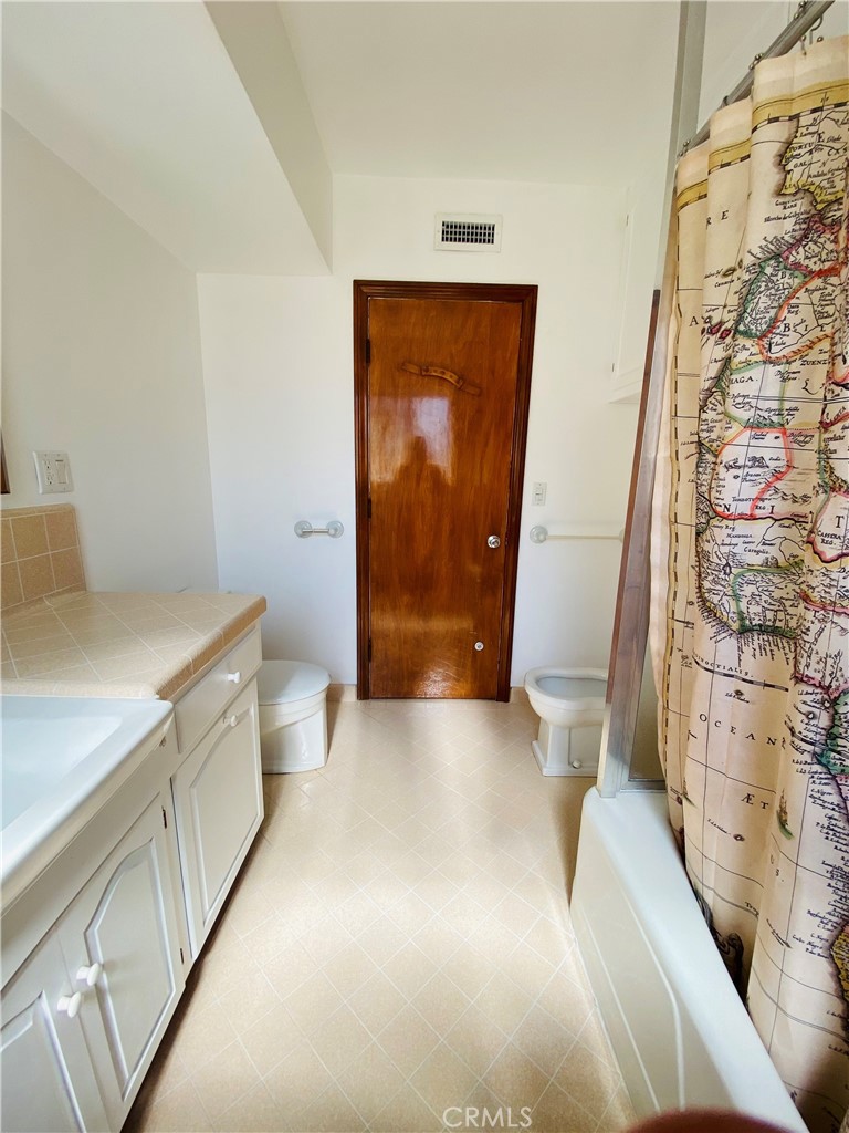 1917 Lyans Drive La Canada Flintridge, CA 91011 - Photo 17 of 25 a bathroom with a sink and a shower