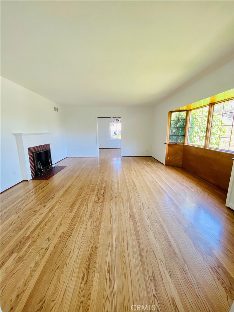 1917 Lyans Drive La Canada Flintridge, CA 91011 - Photo 2 of 25 a view of empty room with wooden floor and fan