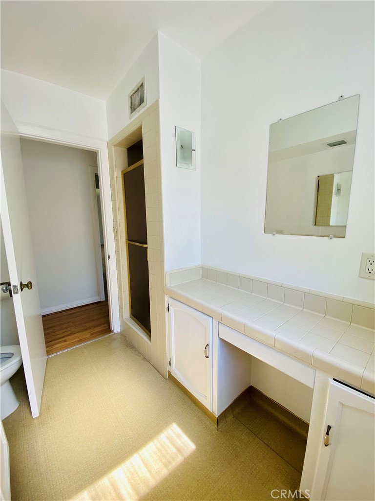 1917 Lyans Drive La Canada Flintridge, CA 91011 - Photo 21 of 25 a room with a bed and cabinets