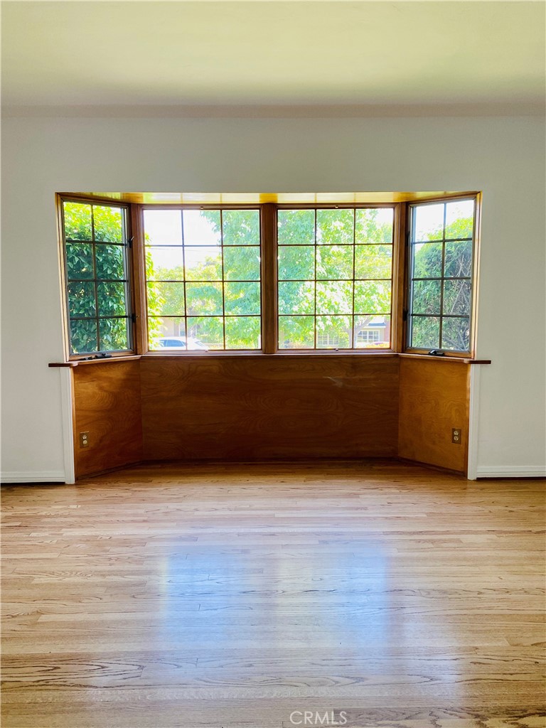 1917 Lyans Drive La Canada Flintridge, CA 91011 - Photo 3 of 25 a view of an empty room with wooden floor and a window