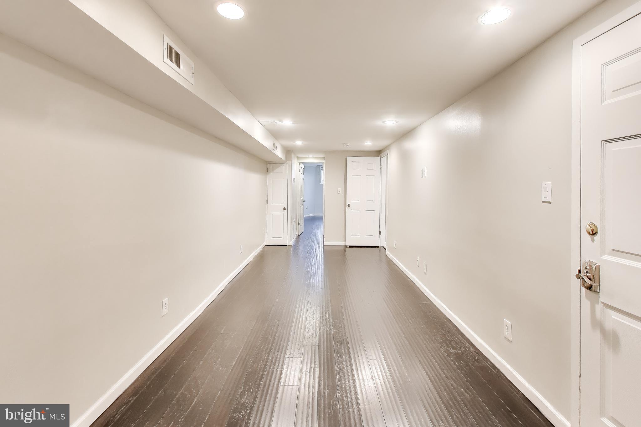 1724 21st Street Northwest, Unit 1 Washington, DC 20009 - Photo 6 of 17 a view of a hallway with wooden floor
