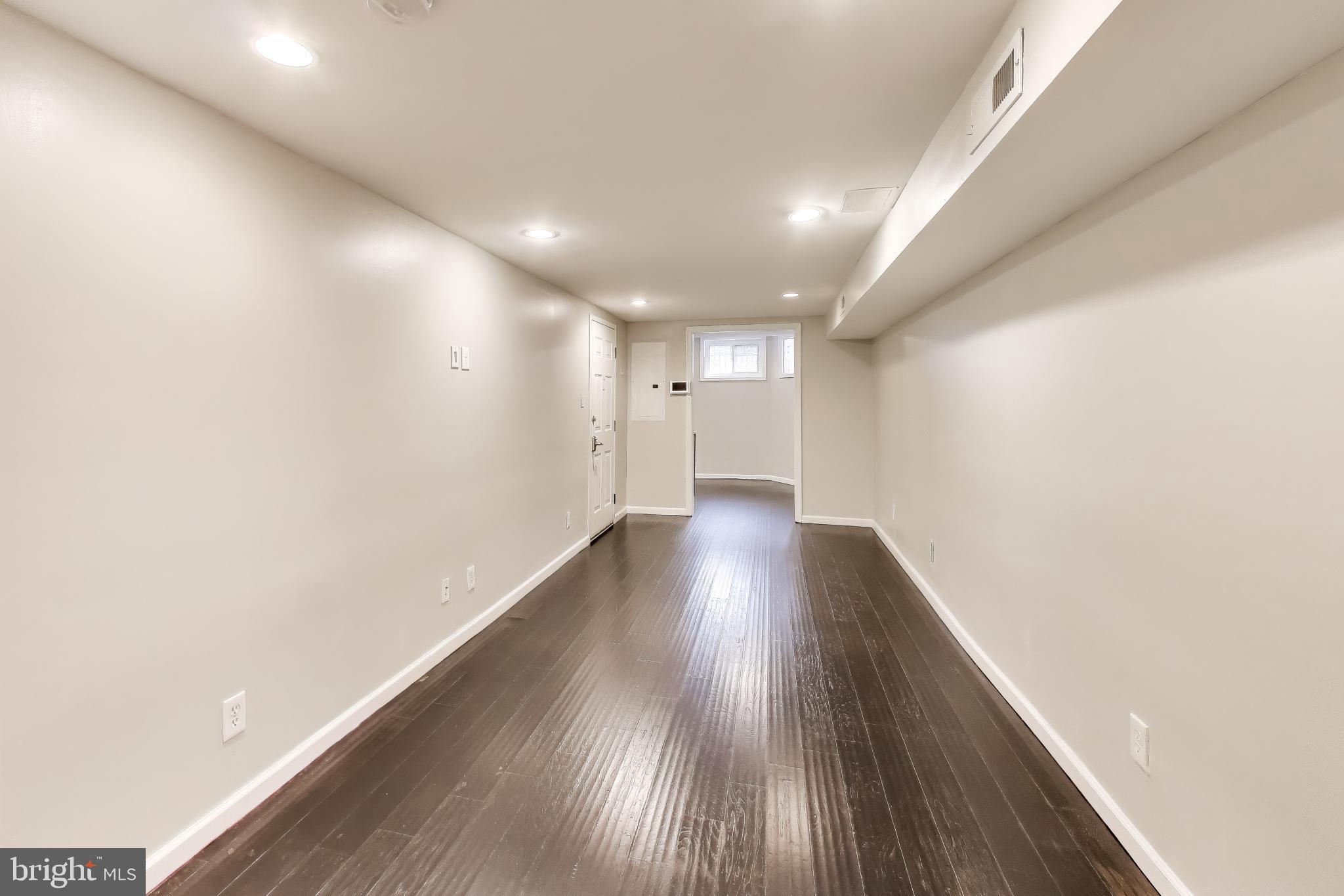 1724 21st Street Northwest, Unit 1 Washington, DC 20009 - Photo 7 of 17 a view of empty room with wooden floor