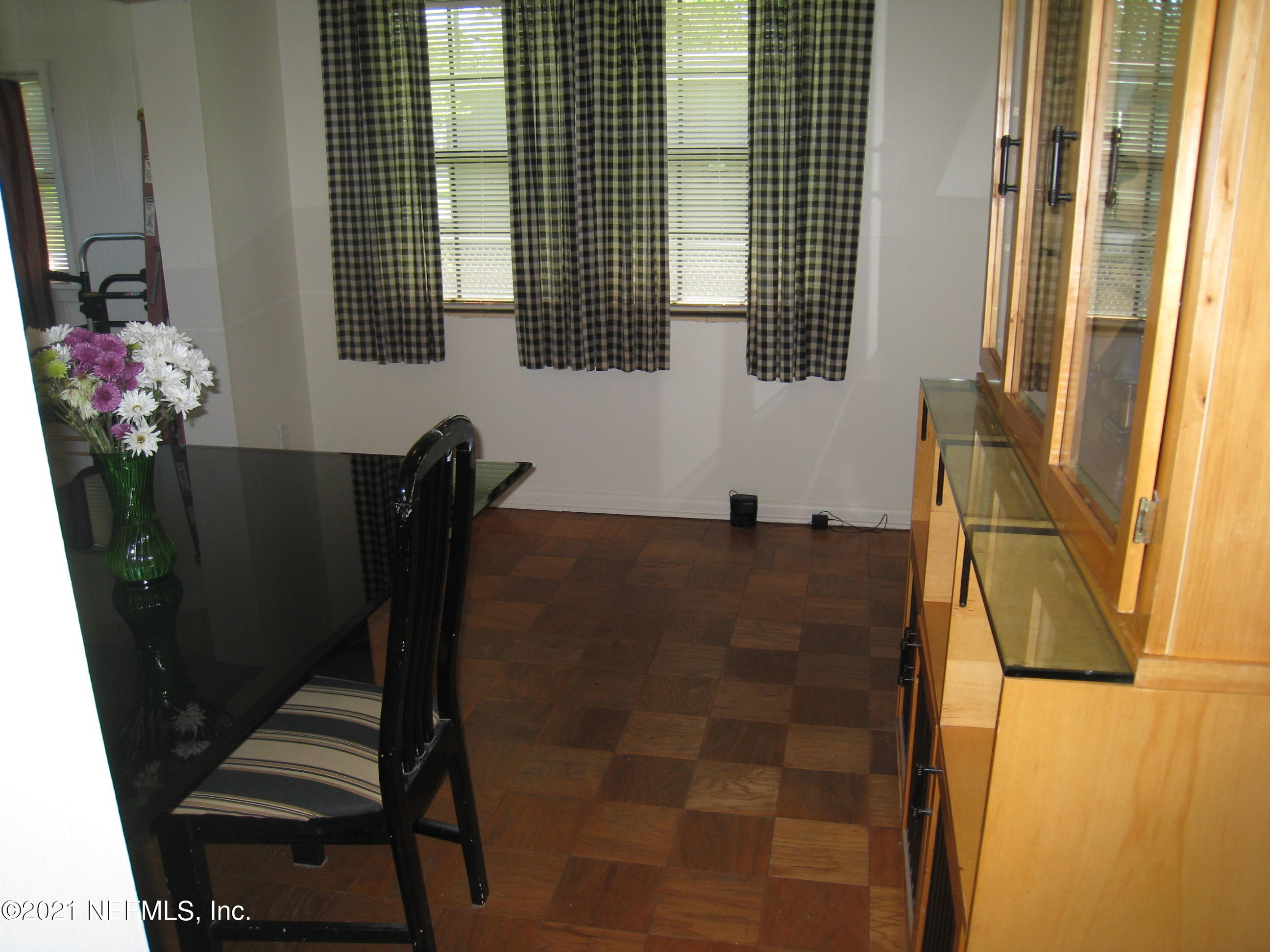 7052 Clovis Road Jacksonville, FL 32205 - Photo 14 of 34 a bathroom with a sink and a mirror