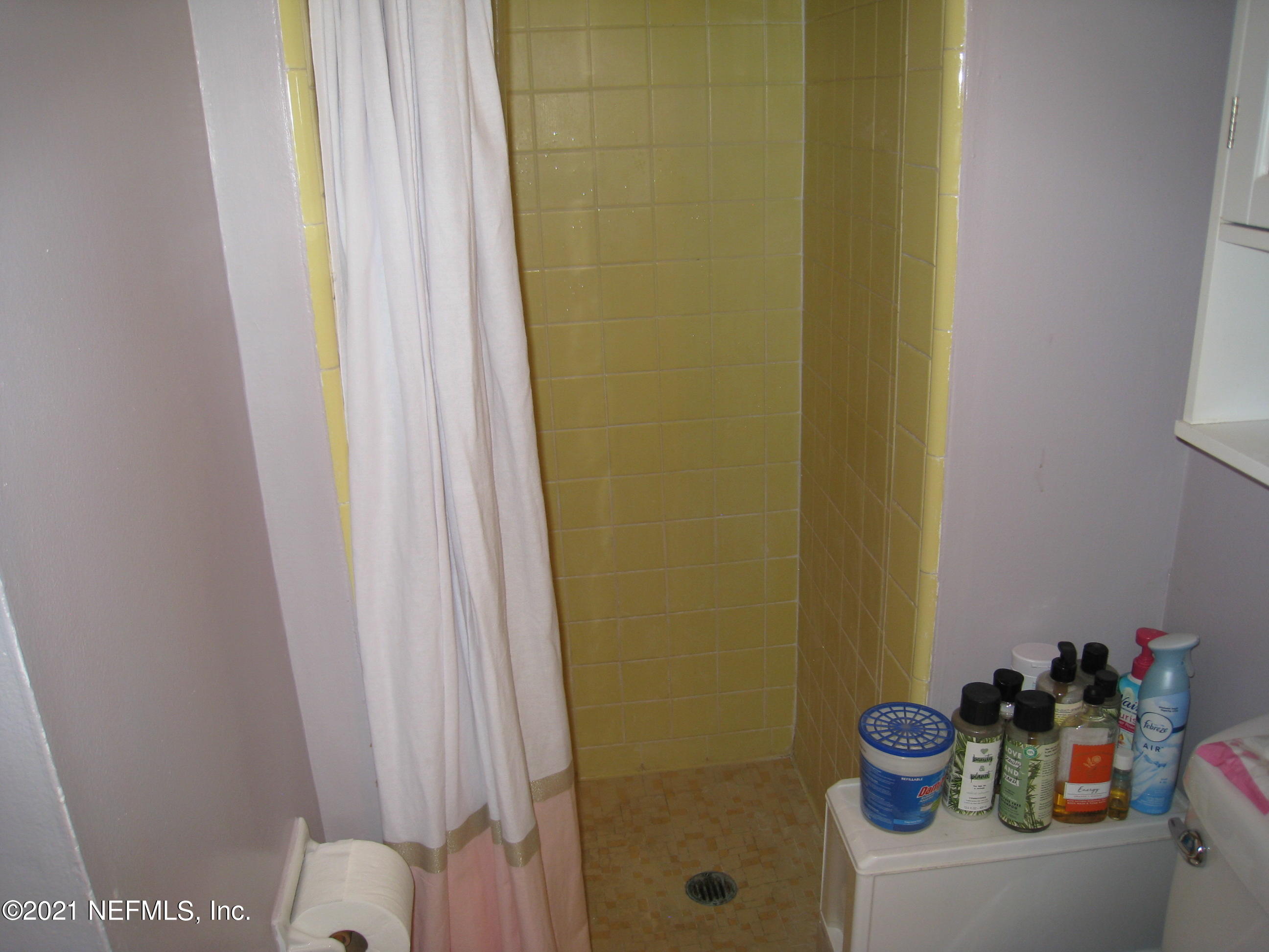 7052 Clovis Road Jacksonville, FL 32205 - Photo 22 of 34 a bathroom with a sink and a shower curtain
