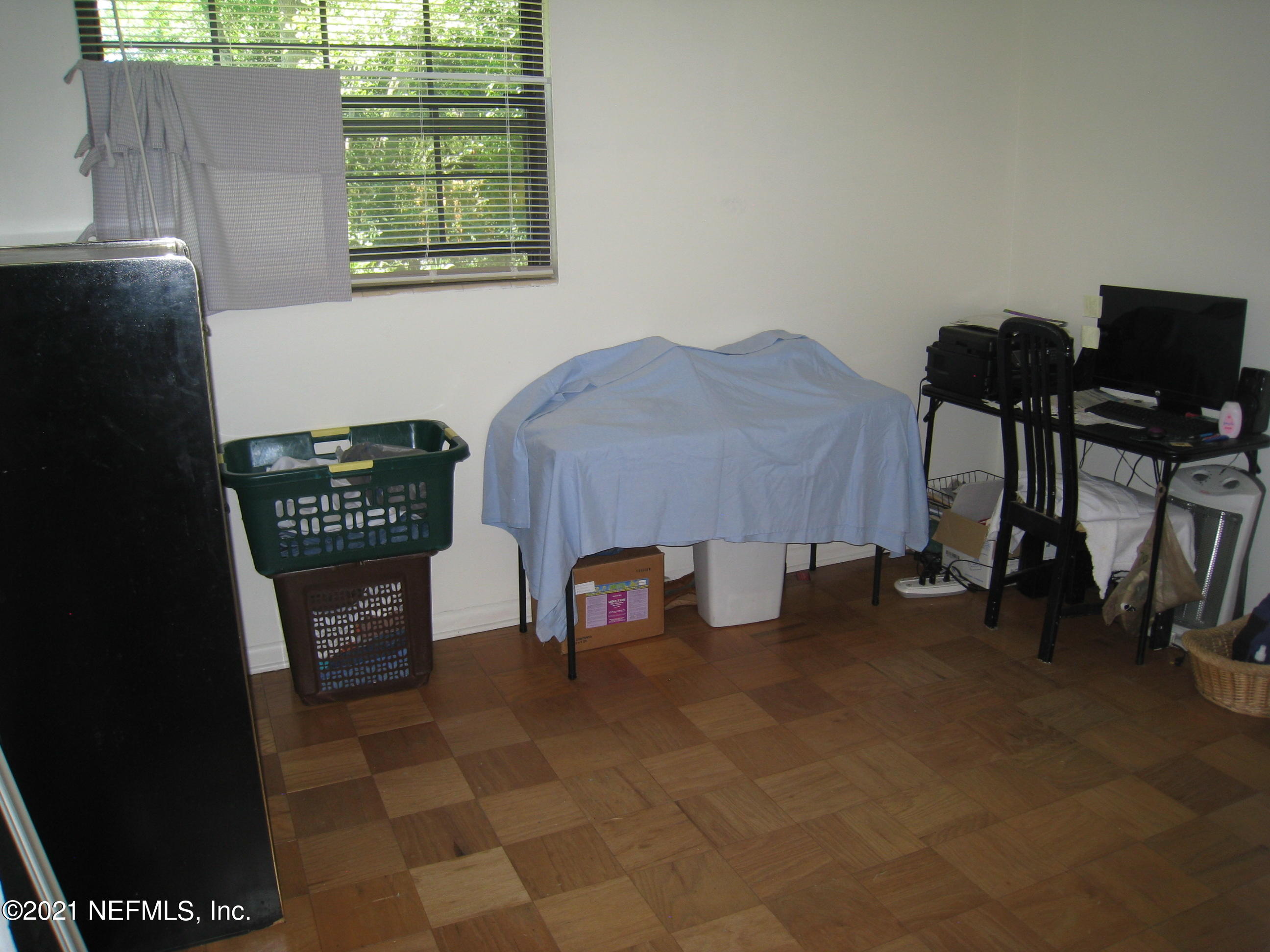 7052 Clovis Road Jacksonville, FL 32205 - Photo 23 of 34 a living room with furniture and a window