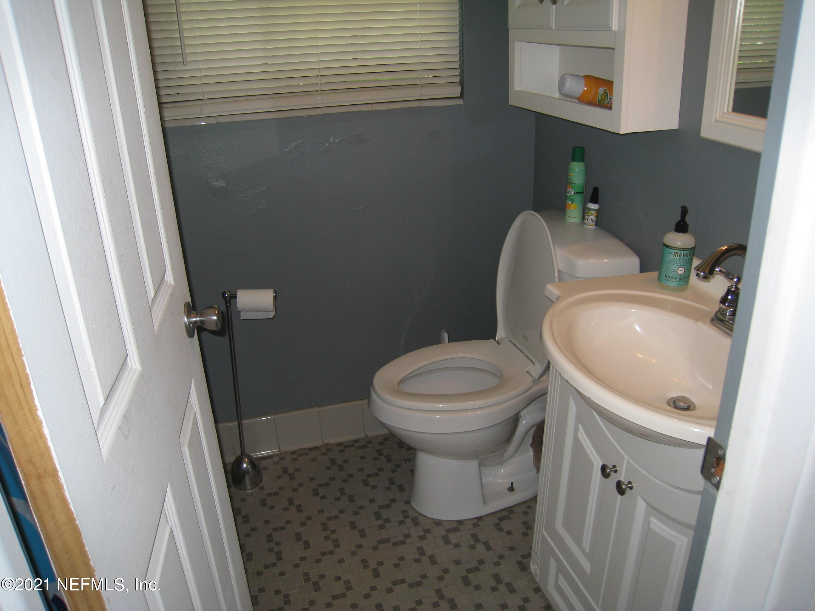 7052 Clovis Road Jacksonville, FL 32205 - Photo 24 of 34 a white toilet sitting next to a bathroom sink