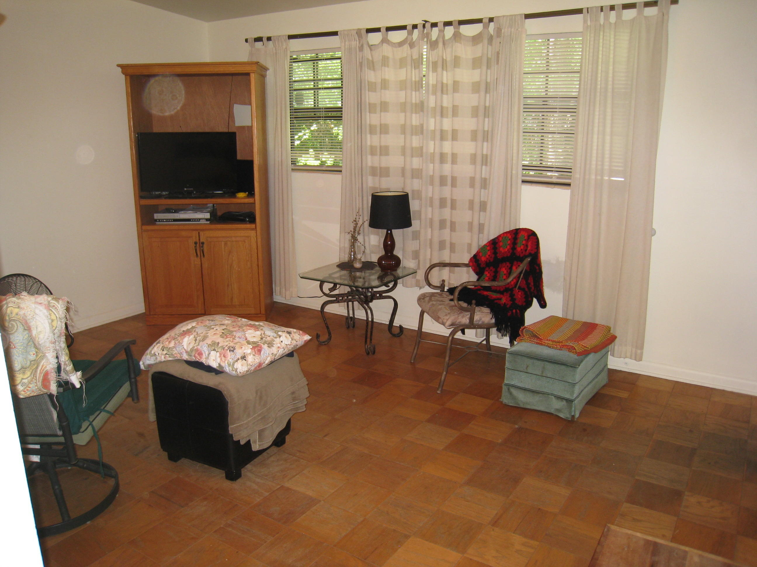 7052 Clovis Road Jacksonville, FL 32205 - Photo 10 of 34 a living room with furniture and a flat screen tv