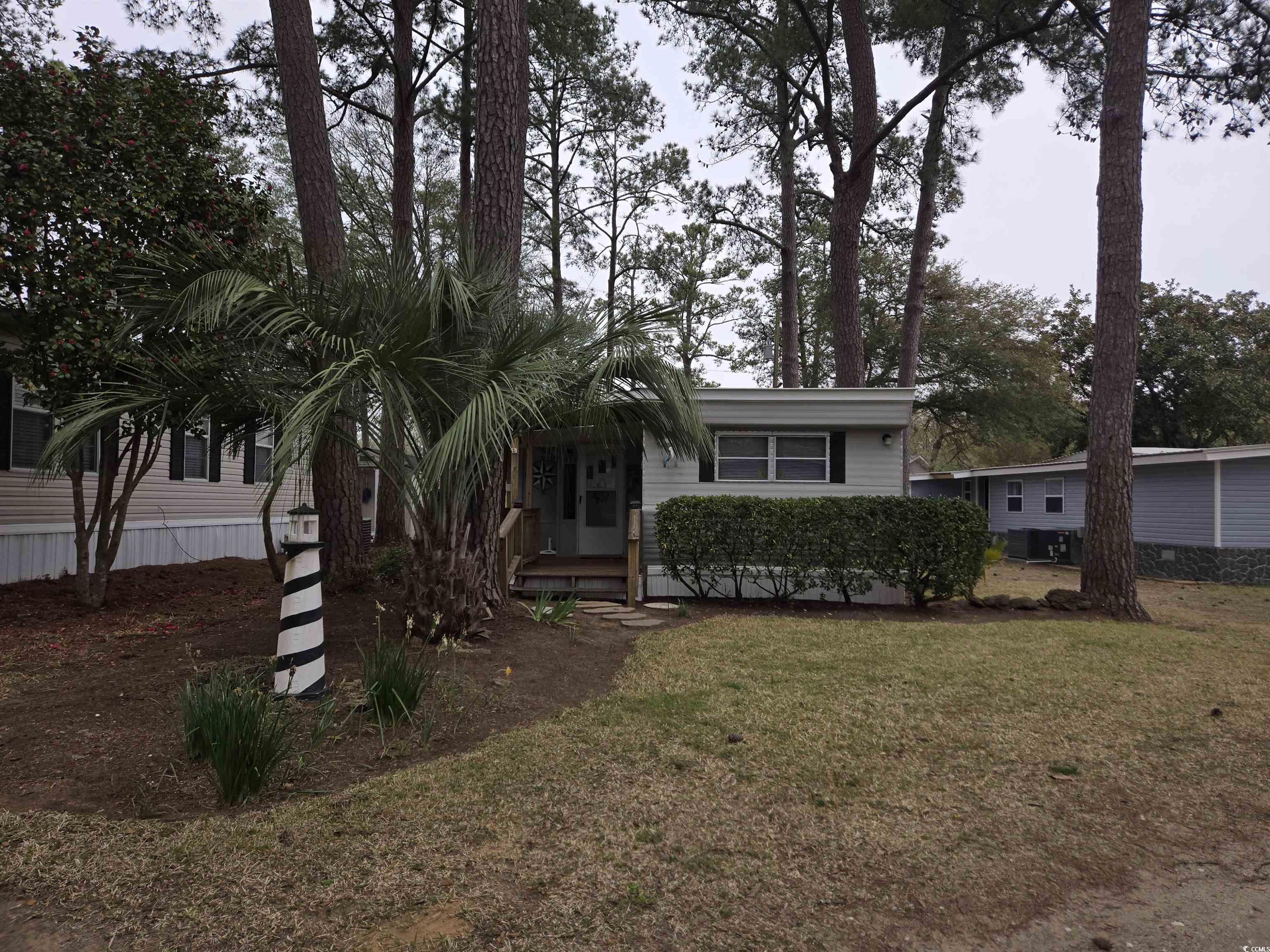 425 Delton Drive Murrells Inlet, SC 29576 - Photo 1 of 34 View of front facade with a front lawn