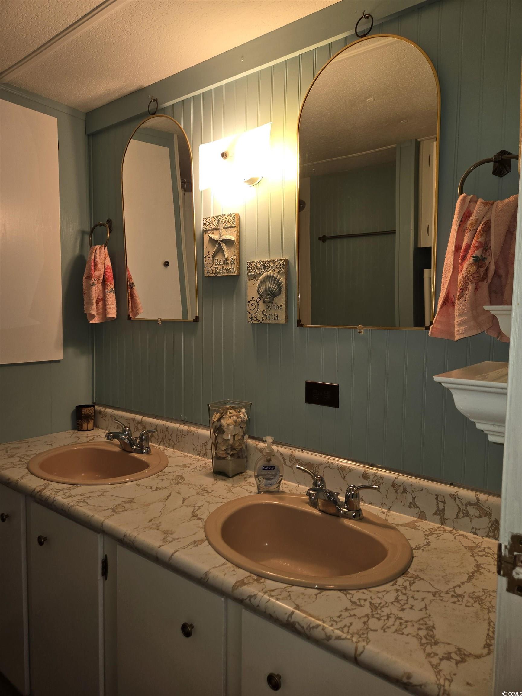 425 Delton Drive Murrells Inlet, SC 29576 - Photo 23 of 34 Full bathroom with a textured ceiling, double vanity, and a sink
