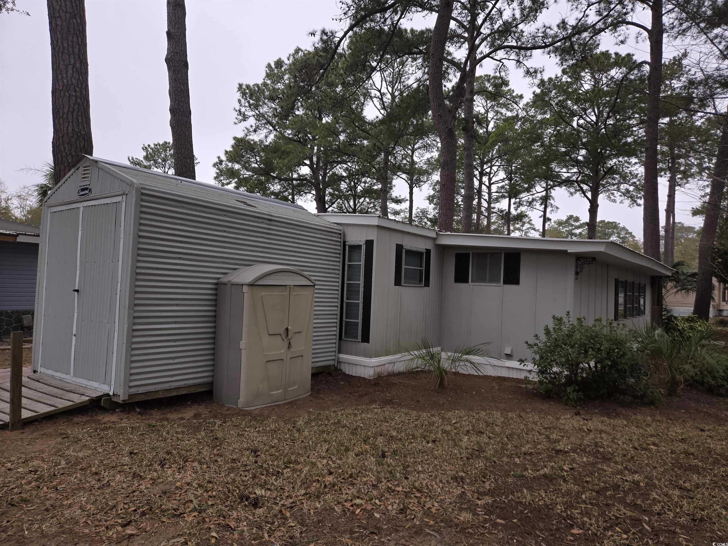 425 Delton Drive Murrells Inlet, SC 29576 - Photo 4 of 34 Rear view of property featuring an outbuilding