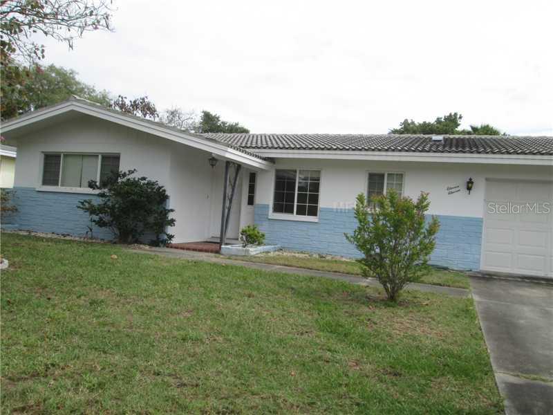 1111 Suemar Road Dunedin, FL 34698 - Photo 1 of 1 a front view of a house with garden