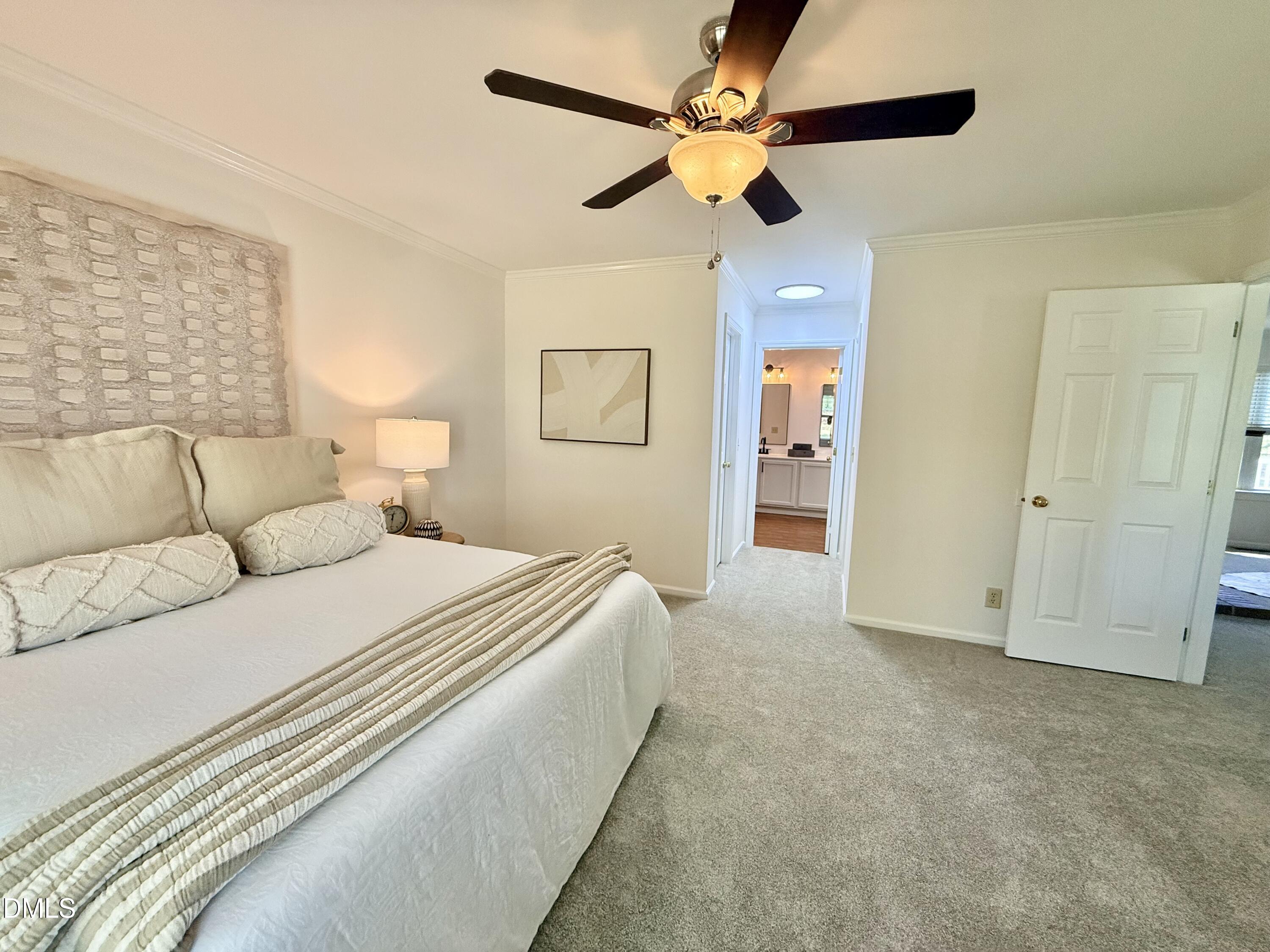 2429 Halifax Road Roxboro, NC 27573 - Photo 27 of 54 a spacious bedroom with a bed and ceiling fan
