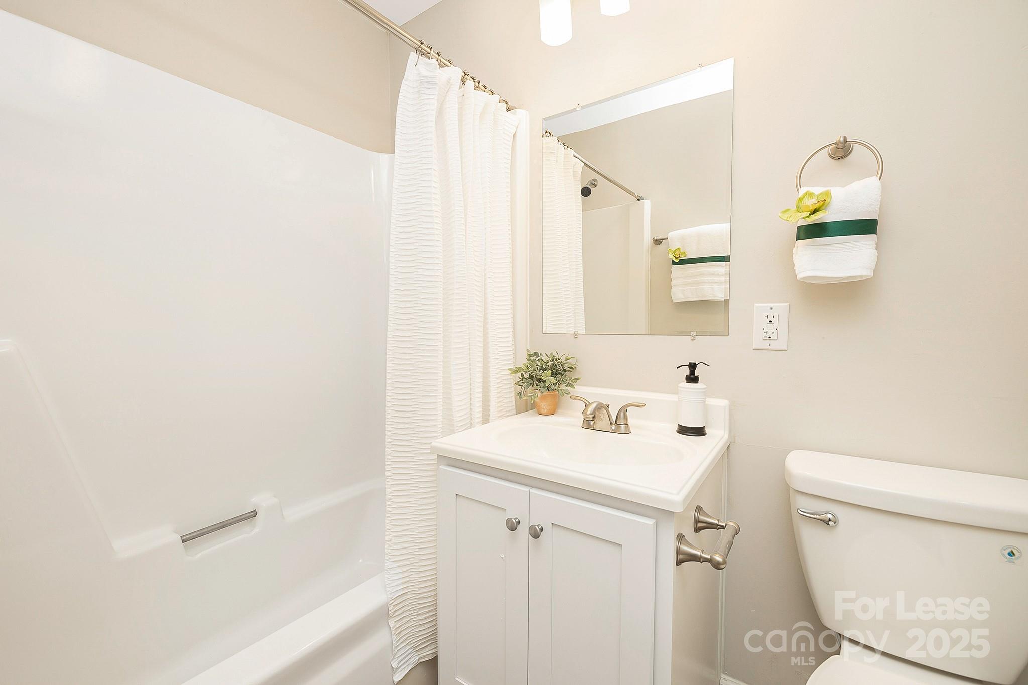 1850 Lowell Bethesda Road, Unit 7 Gastonia, NC 28056 - Photo 6 of 9 a bathroom with a sink a toilet and shower