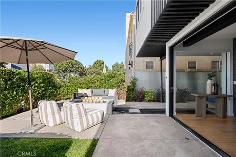 a view of a chair and table in the patio